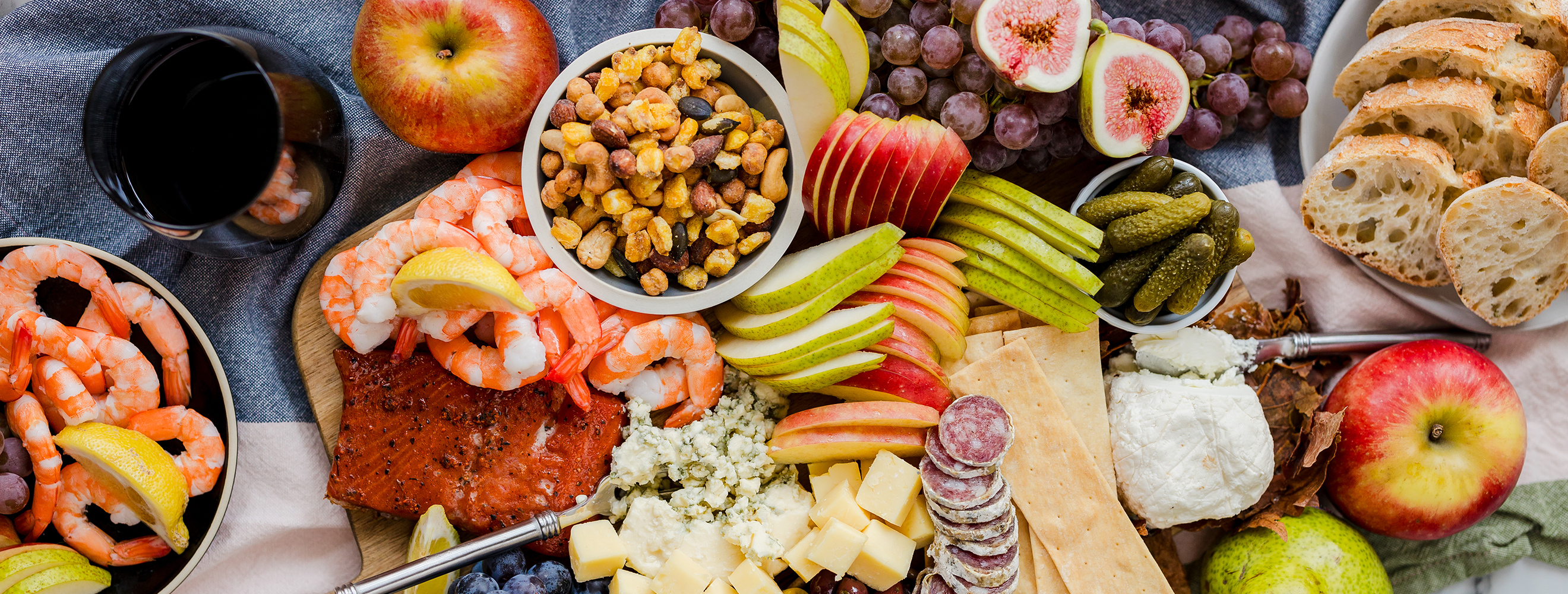 Fall charcuterie spread with apples, nuts, fruit, shrimp and more!