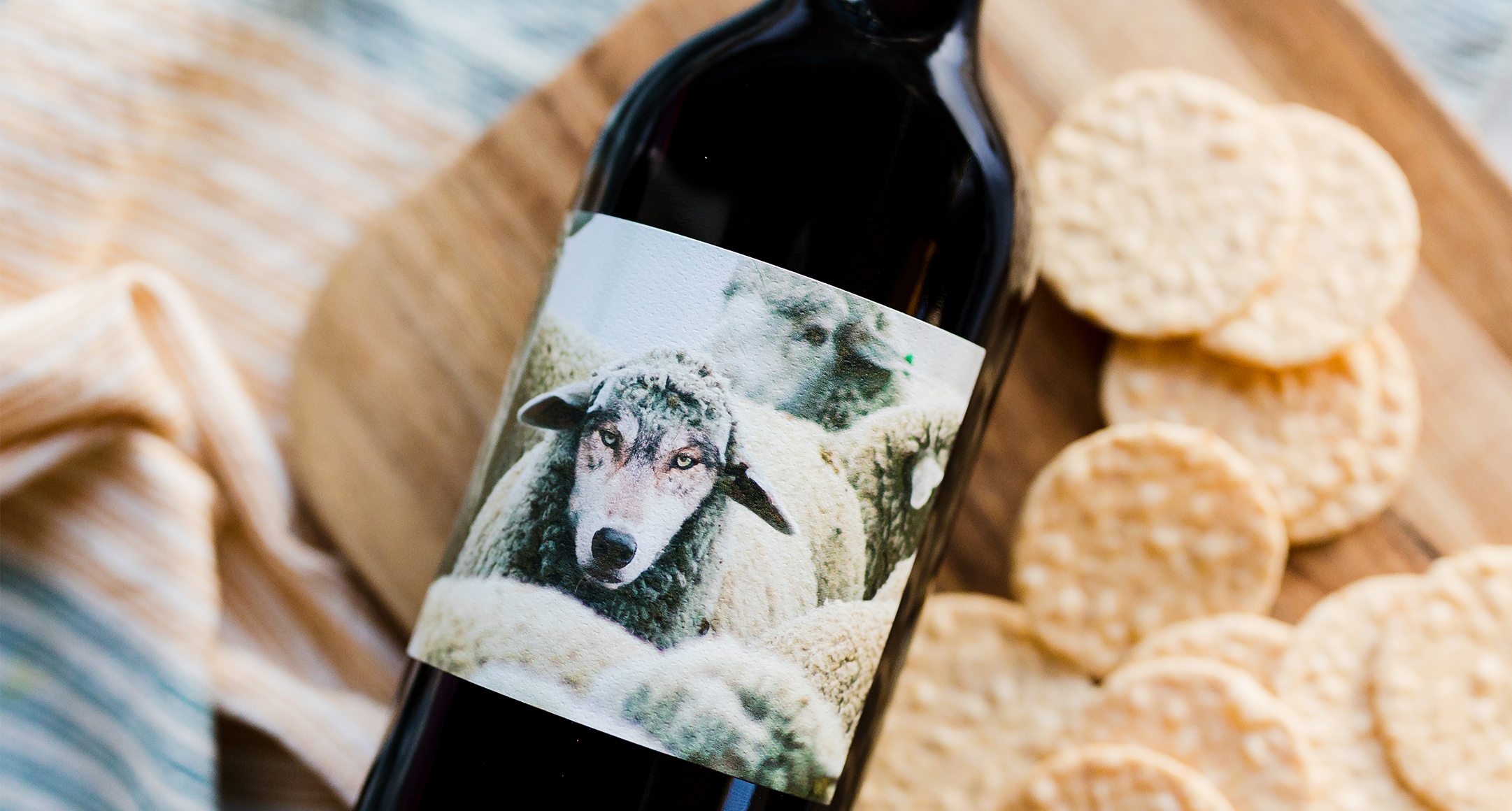 A bottle of Maison Noir Wine featuring a wolf-sheep hybrid creature. 