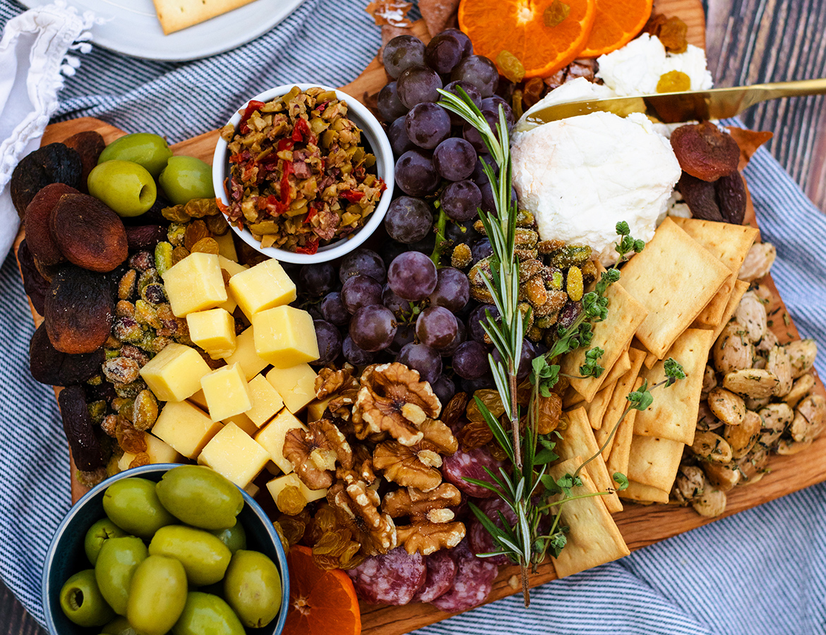 charcuterie board featuring Oregon cheeses, nuts, fruits, olives and more!